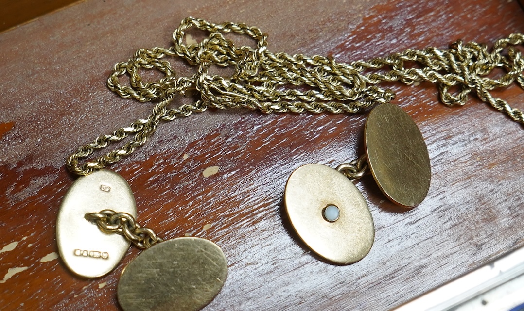 A pair of 9ct gold and seed pearl cufflinks, each end of oval outline, two accented with half pearls, to chain link connections, each end 1.9 x 1.3cm, British hallmarks, date letter for 1991, gross weight approximately 9